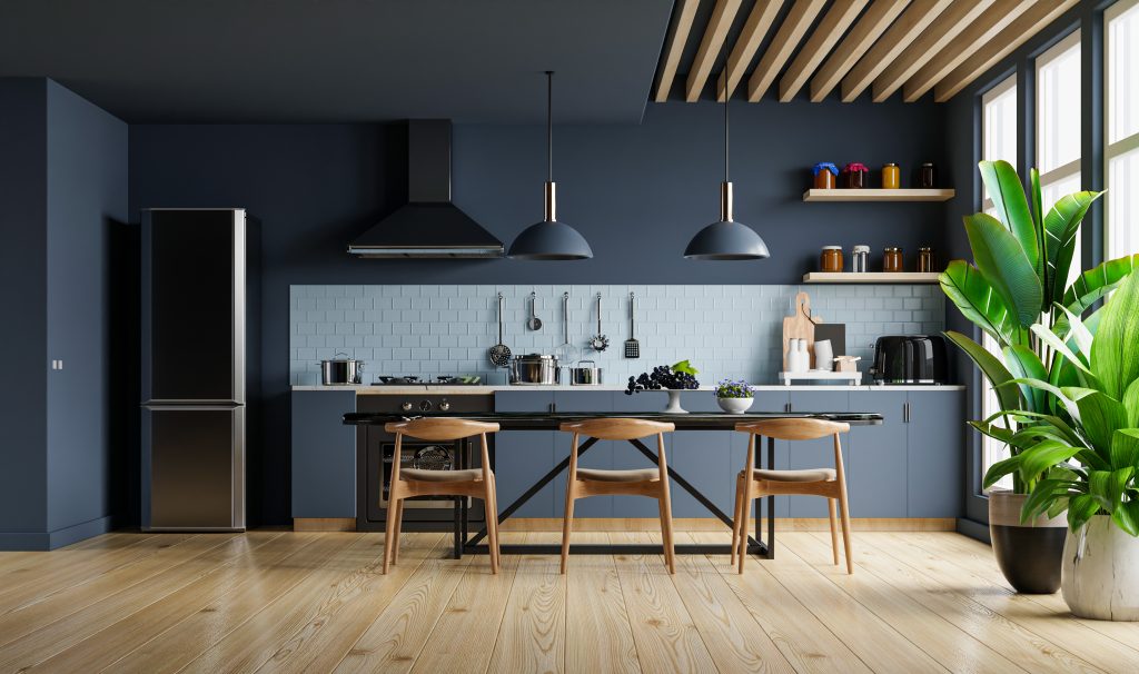 Modern kitchen interior design with dark blue wall